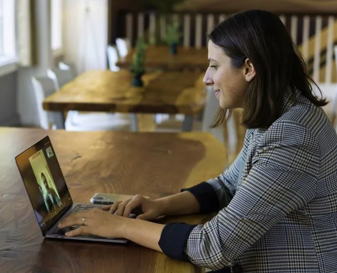 Illustrative photograph of a woman learning on a laptop